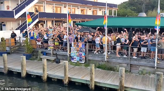 One TikTok user filmed their view from the ferry arriving at the Pines in time for July 4. Pictured are revellers at 'tea' - the party that kicks off the day
