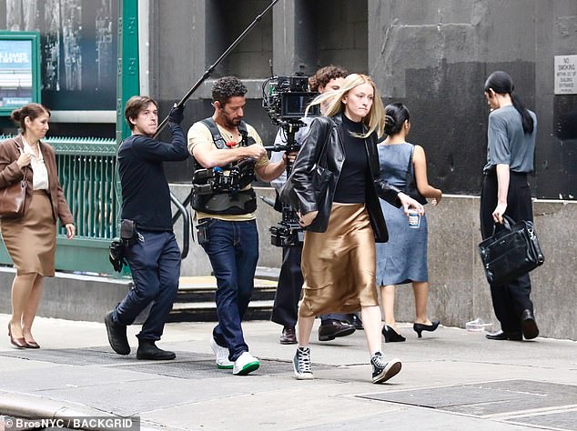 For Pidgeon does not appear to be outfitted in Carolyn's capsule wardrobe consisting of Prada and Yamamoto. Instead, this actress is clearly wearing fast fashion — fabrics that read as thin, unstructured, and so cheap as to be highly flammable. (Pictured: Pidgeon filming 'American Love Story')