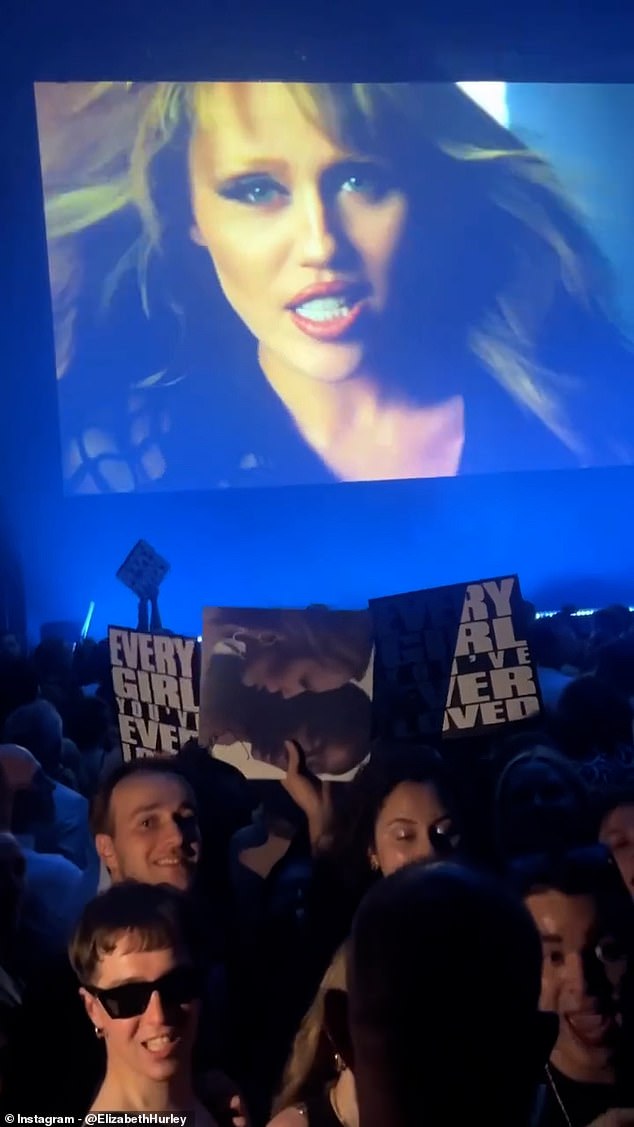 Damian and Miley appear to have a strong bond as they stood shoulder-to-shoulder while watching the movie
