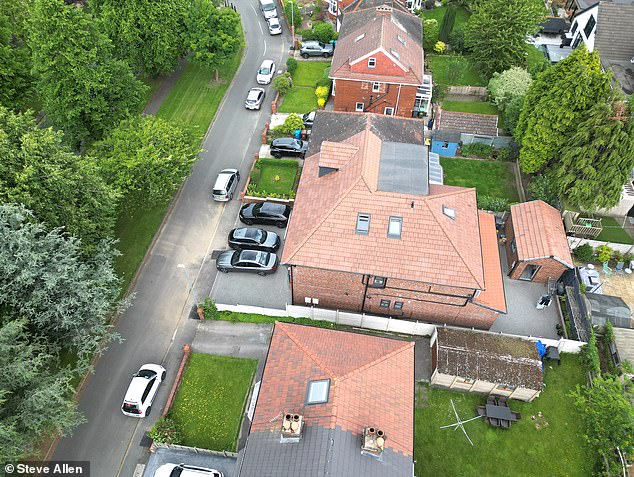 An aerial image shows the house which stands out on the road in Oldham