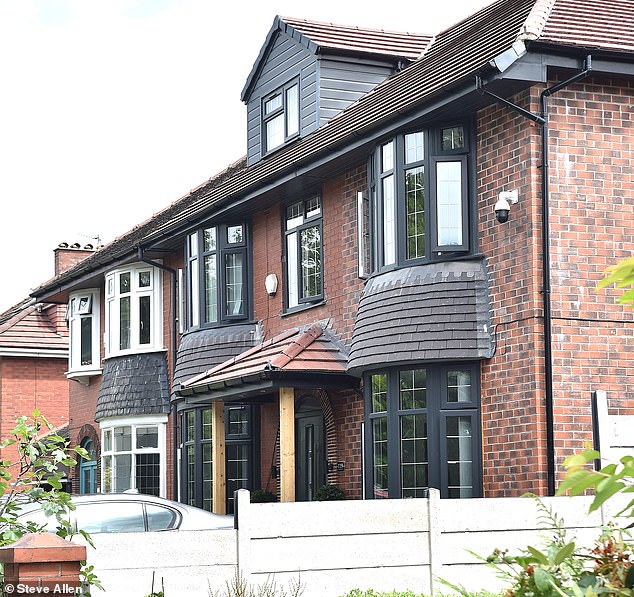 Picture shows the new modified porch with wooden columns