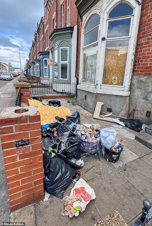 Homes are abandoned on the once-prestigious road with graffiti on walls and litter dumped in messy gardens