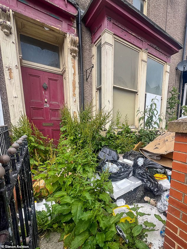 Litter and bin bags were left outside at one abandoned property on the road with weeds taking over the garden