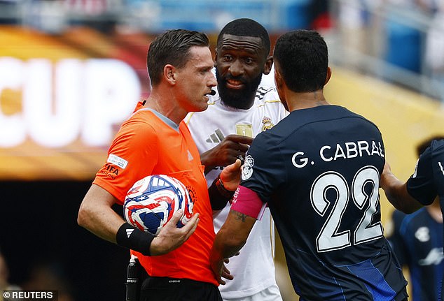 Rudiger complained to Brazilian referee Ramon Abatti Abel (left), who later made an arm signal