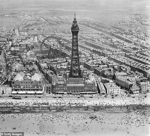 Blackpool Tower, the Big Wheel and the resort's beach seen from the air in 1920