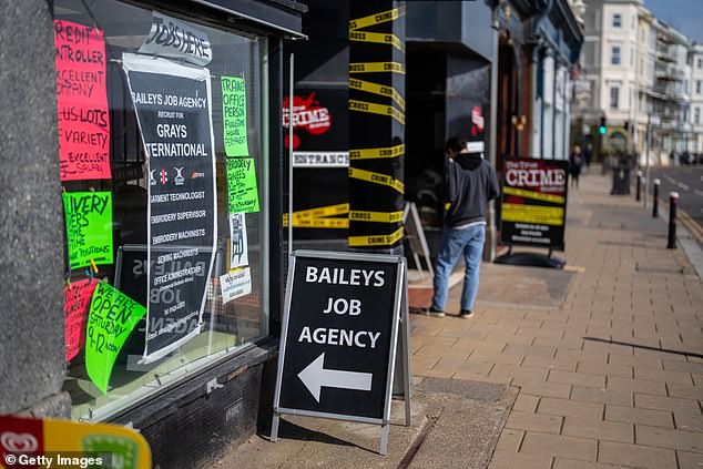 A sign advertises a job agency in Hastings, March 2024
