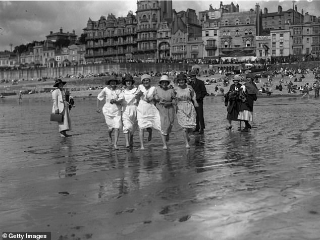 Workers from the Ticklers Jam factory enjoy the beach at Hastings while on a day out in 1923. Seasidehistory.co.uk explains that 'the 20s and 30s was a time of huge expansion in the numbers of people taking holidays in the UK'