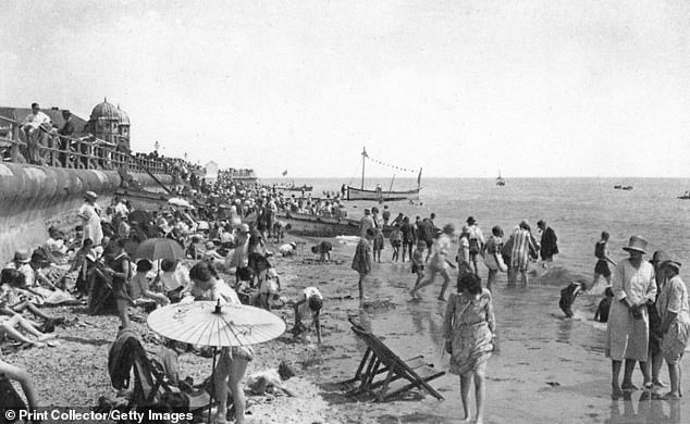 Holidaymakers enjoy the beach at Bognor regis in the early 20th century