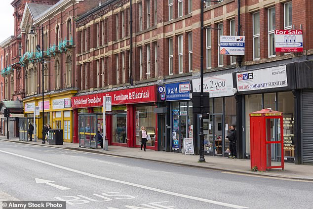 Several charity shops seen on Knowsley Street in Bolton, Lancashire