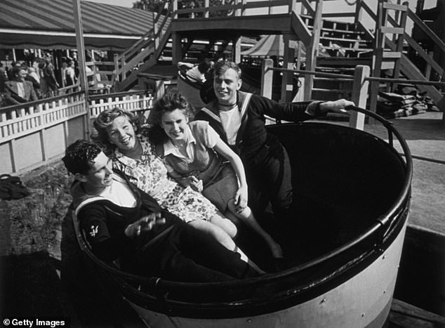 Visitors to the Southend funfair enjoying one of the rides, August 11, 1945