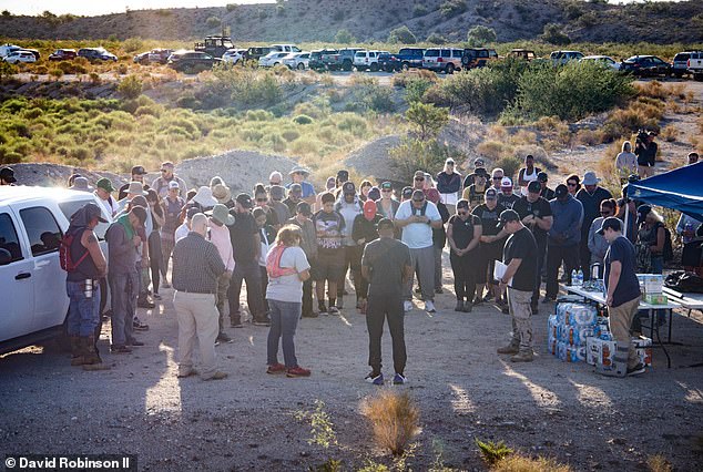 Robinson is pictured with a group of volunteers who helped in the search for his son in the Arizona desert