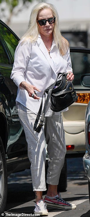 During her latest sighting, now aged 65, she still had the platinum locks she sported when she first shot to fame