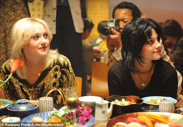 The legacy of her band lived on in the form of the 2010 biopic the Runaways, in which Kristen Stewart (right) played Joan Jett and Dakota Fanning (left) played Cherie