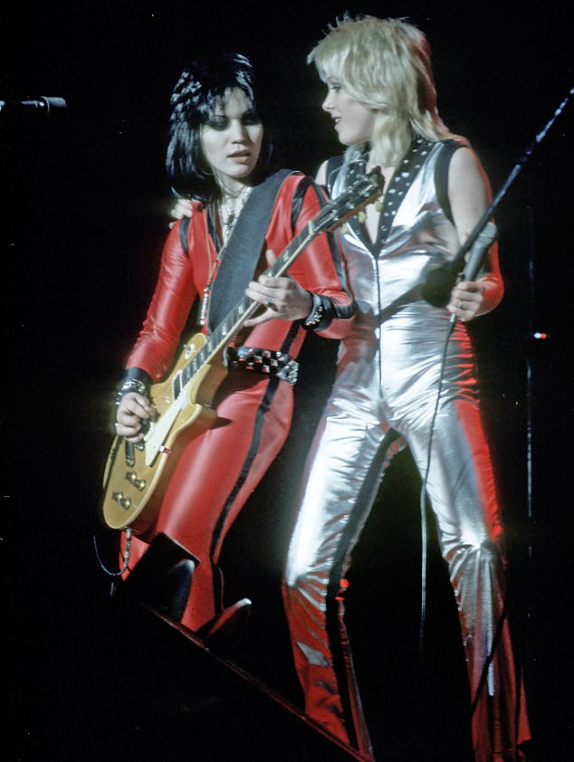 Cherie is pictured in 1977 performing with her bandmate Joan Jett (left), who in her post-Runaways years sang a cover of I Love Rock 'n' Roll that gave it worldwide popularity