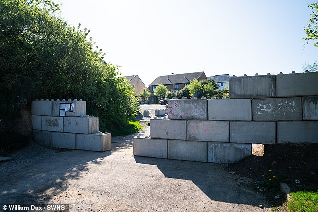 In April, West Devon Borough Council issued an enforcement notice ordering Leander Developments to remove the unauthorised structure dubbed by locals as the ' Berlin Wall' between the two housing estates in Kellands Lane