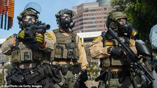 The LA County Sheriff's Department expressed condolences for the 'tragic' US bombing of Iranian nuclear sites on Sunday in a since-censored post. (Pictured: Three LA sheriffs)