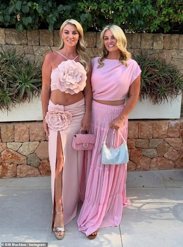 She accessorised her pink look perfectly with a Chanel bag as she posed with a pal