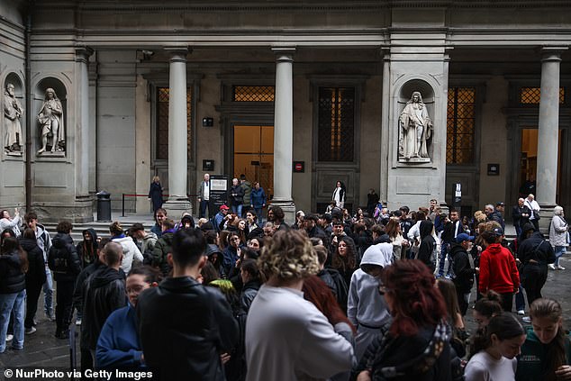The incident occurred on Saturday in the ground-floor rooms hosting the Florence and Europe: Arts of the 18th Century at the Uffizi exhibition, the first under the gallery's new director, Simone Verde. Pictured: People waiting at the courtyard to visit Uffizi Galleries in Florence, Italy