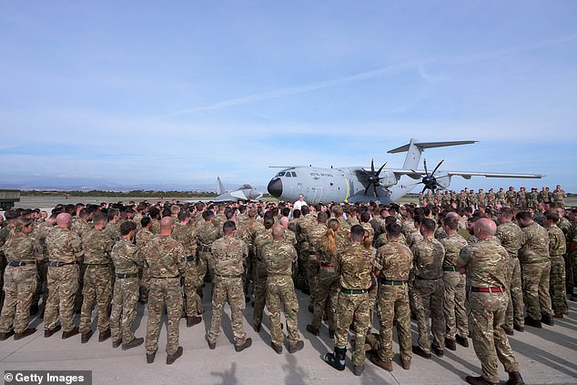 Among the bases potentially at threat includes RAF Akrotiri in Cyprus. Pictured are troops at the facility listening to a speech by Sir Keir Starmer during his visit there in December 2024