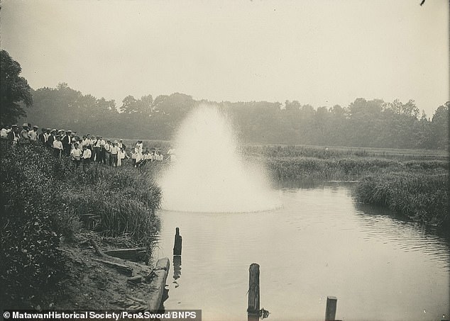 Dynamite was laid in an attempt to kill sharks in the water. Above: The moment dynamite was detonated as locals watched