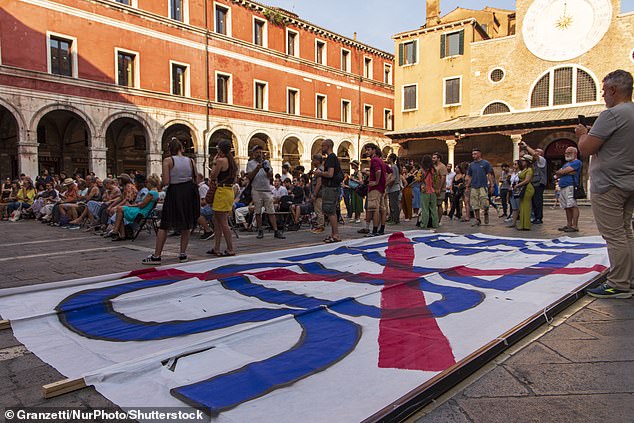 On its social media the group says: 'Jeff Bezos and his clique of super rich people are not welcome in Venice' adding that the city cannot be 'a showcase for the elite'