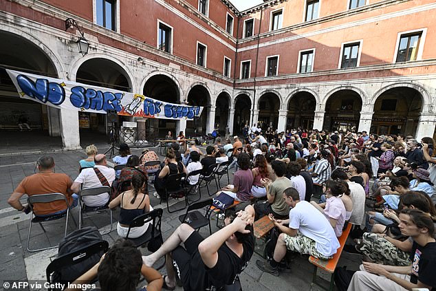 Campaign group No Space for Bezos has organised a huge protest for next Saturday with demonstrators being encouraged to bring googles and inflatables so they can dive into canals and disrupt taxis ferrying guests. Pictured: People gathered on June 13 to protest against the wedding