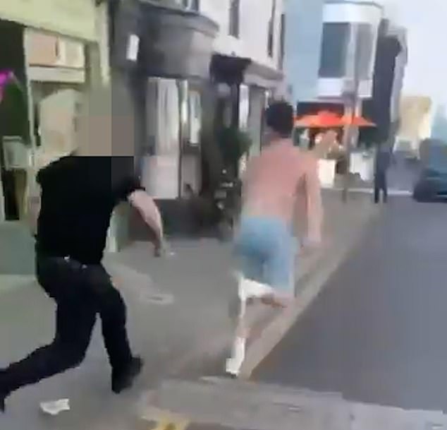 After a projectile eventually smashes a restaurant window, one of the employees gives chase
