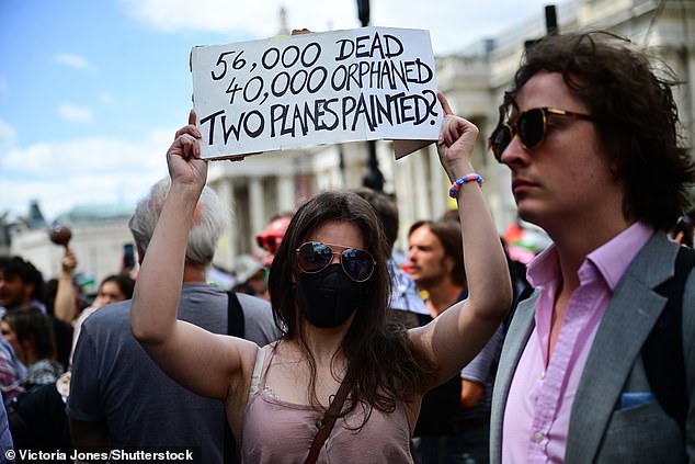 Pro-Palestine protesters were seen holding up placards condemning the war in Gaza