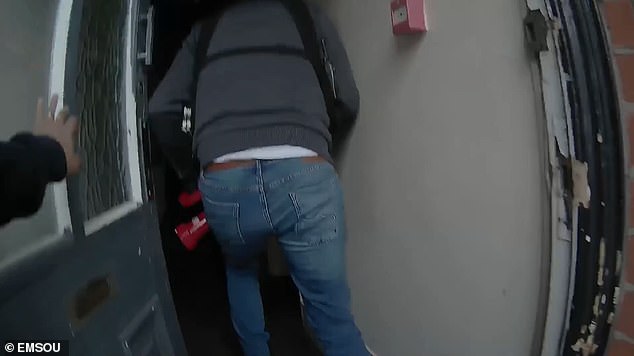 Kananala used his home address to receive the cash. Pictured are officers breaking into the property to detain the crook