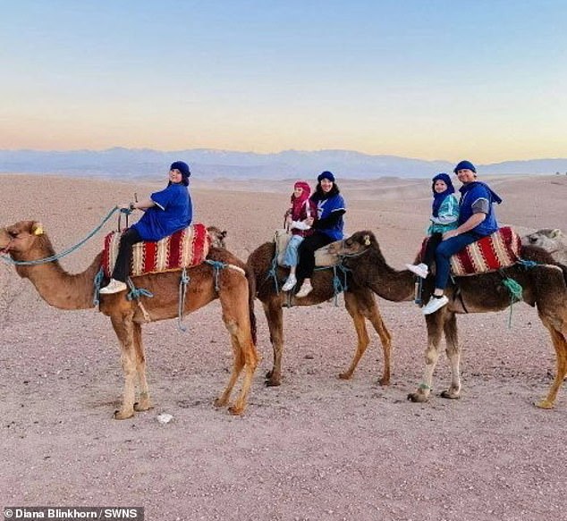 Diana and Scott and their three daughters rode on camels in the desert in Morocco