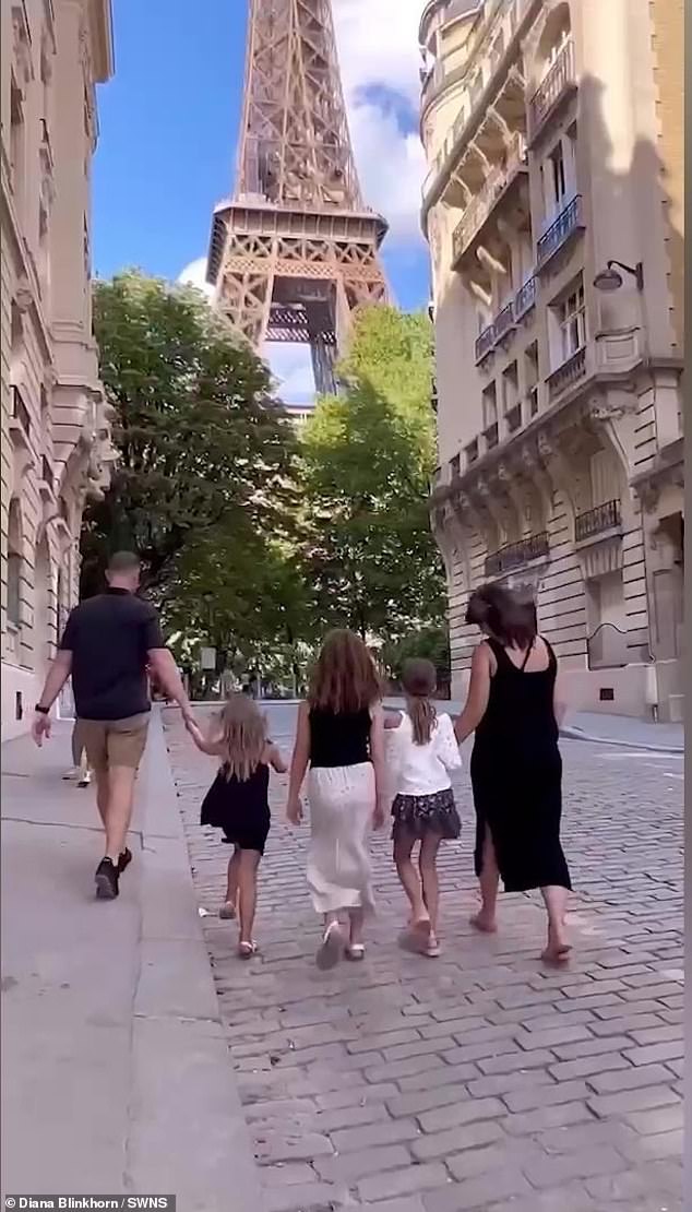 Diana and Scott with their three daughters in Paris, where they visited the Eiffel Tower