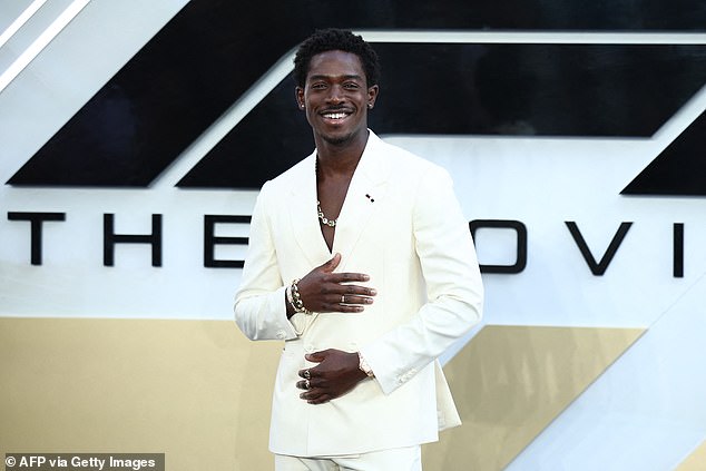 British actor Damson Idris oozed class in a ultra-white suit as he stopped on the carpet to pose for pictures
