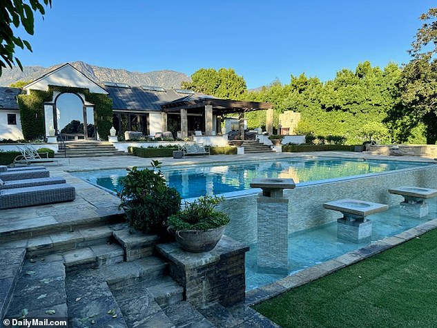 The mansion's backyard, equipped with a luxury porch, pool, launch chairs and staggered fountains. Carl Wescott's family attempted to argue that he was not sound of mind due to his medication when he agreed to the deal