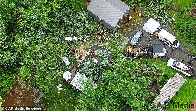 Photos showed the storm had done extensive damage in the area, knocking down trees, utility poles and wires