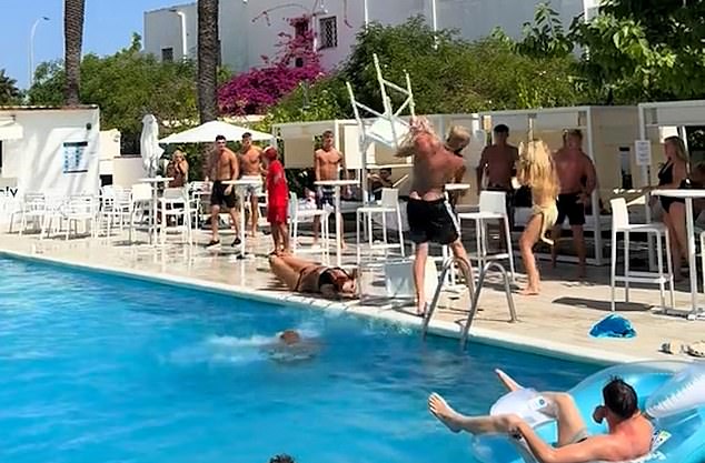 One women then suddenly dropped to the floor after being walloped by a plastic chair