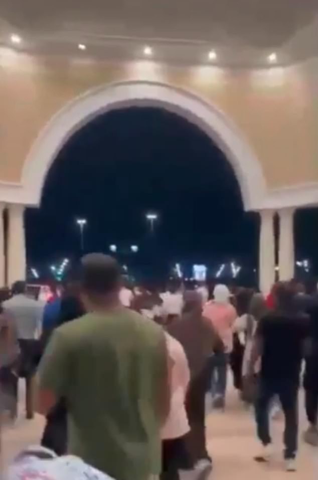 Frightened mothers were seen clutching at their children as they ran out of the Villaggio Mall