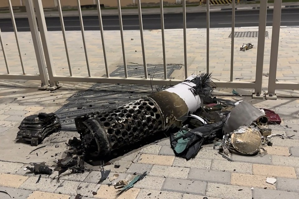 Remnants of an intercepted Iranian missile on a pavement.
