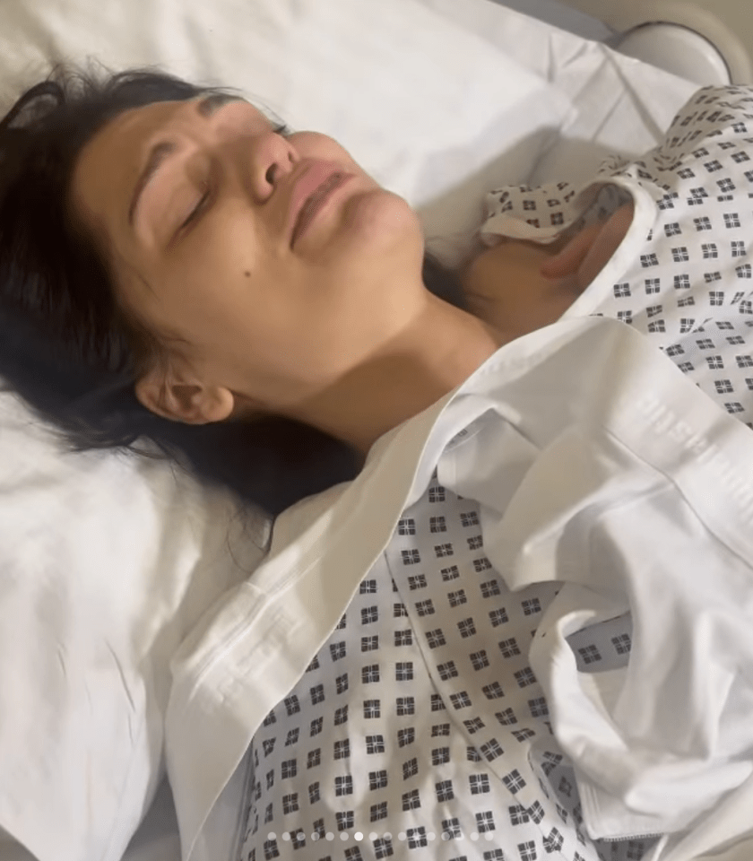 Woman lying in a hospital bed.