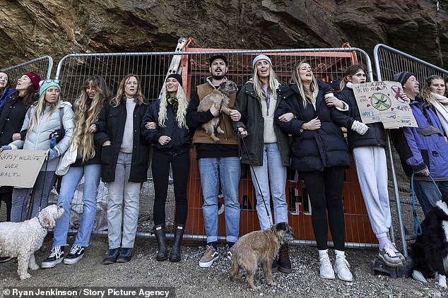 Love Island contestant Lucie Donlan (centre left, black hat) joins protests at Whipsiderry Beach in Newquay on March 2, 2023