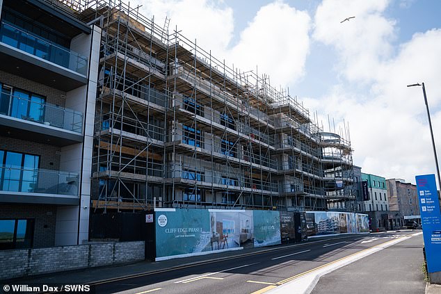 One resident claimed the development is not 'waterproof' and floods are 'routine in the basement, the electrical room and in some apartments'