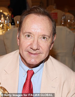 Kevin pictured with his gong on Monday evening in Italy