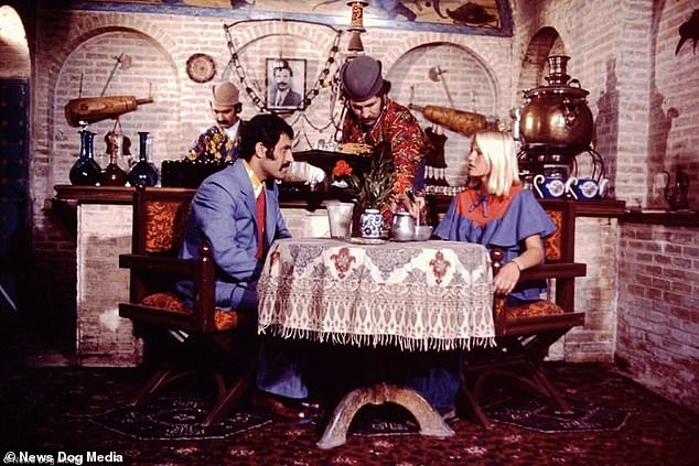 The Shah's determination to showcase an increasingly liberal and modern front to the world and ban on religious garments frustrated traditionalists in Iran. Pictured above: A couple dine in Tehran in the 1960s