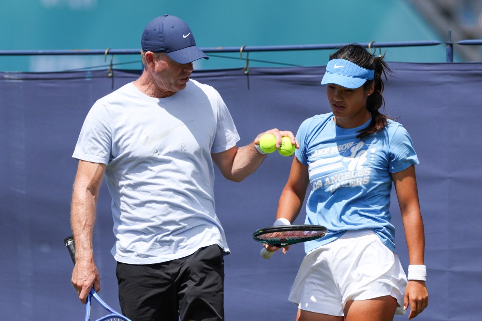 Emma Raducanu warming up with her coach, Mark Petchey.