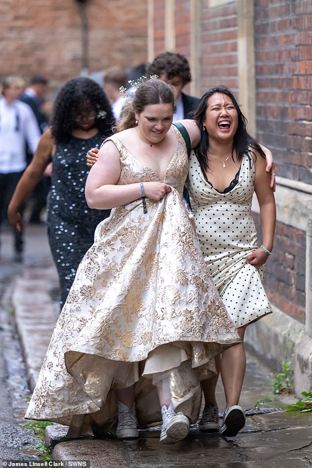 Others took to the rain better, laughing off the grey skies and rainy weather while reflecting on the night before