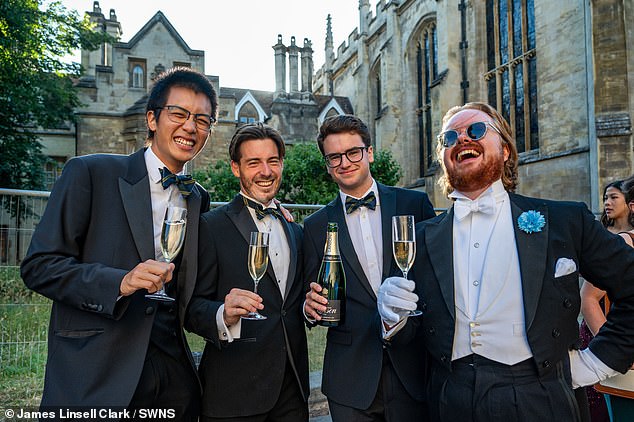 Guests appeared in high spirits as they posed for pictures while proudly holding up glasses of bubbly in their extravagant suits