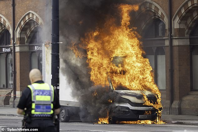 Travellers were evacuated from the rail station after the van erupted in flames just after 10am
