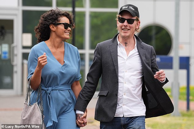 Former GB News presenter Laurence Fox (right) announced in June last year his engagement to girlfriend Elizabeth Barker (left)