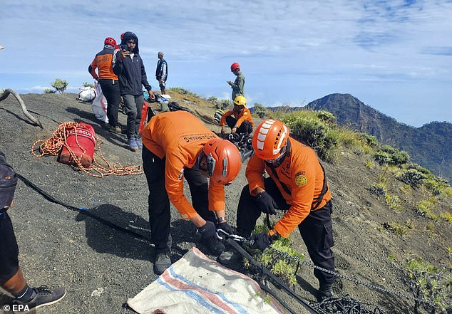 A handout photo made available by Indonesia's Search and Rescue Agency (BASARNAS) shows rescuers preparing for a rescue operation for a Brazilian tourist who fell while hiking on Mount Rinjani, Lombok Island, West Nusa Tenggara Province, Indonesia, 24 June 2025
