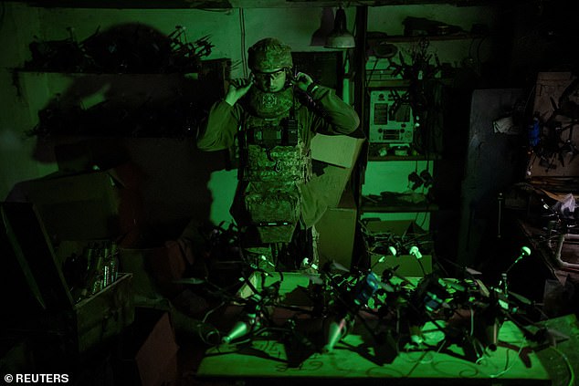 A service member of the 429th Achilles Separate Unmanned Aerial Systems Regiment stands next to FPV-drones at a position near the front line town of Kupiansk, amid Russia's attack on Ukraine, in Kharkiv region, Ukraine June 23, 2025