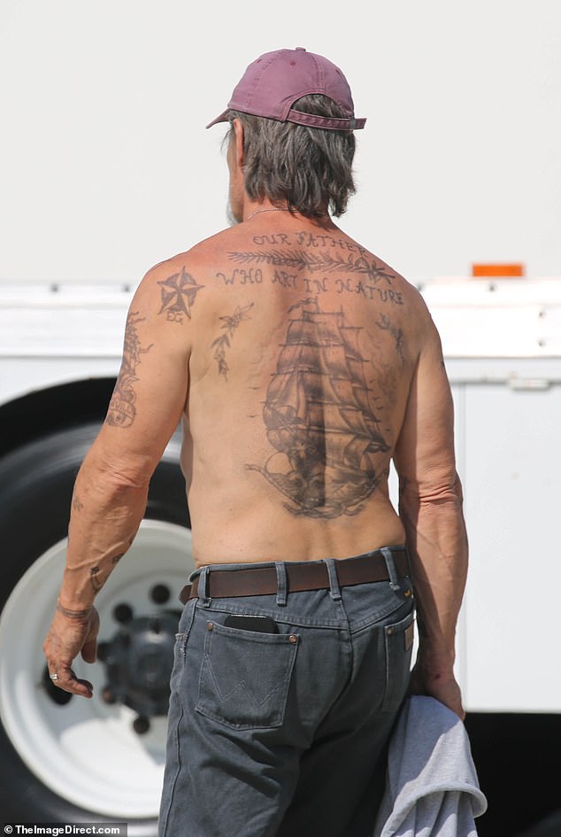 The 57-year-old veteran actor went shirtless at the San Pedro, California location, adding dark jeans and a faded purple baseball cap
